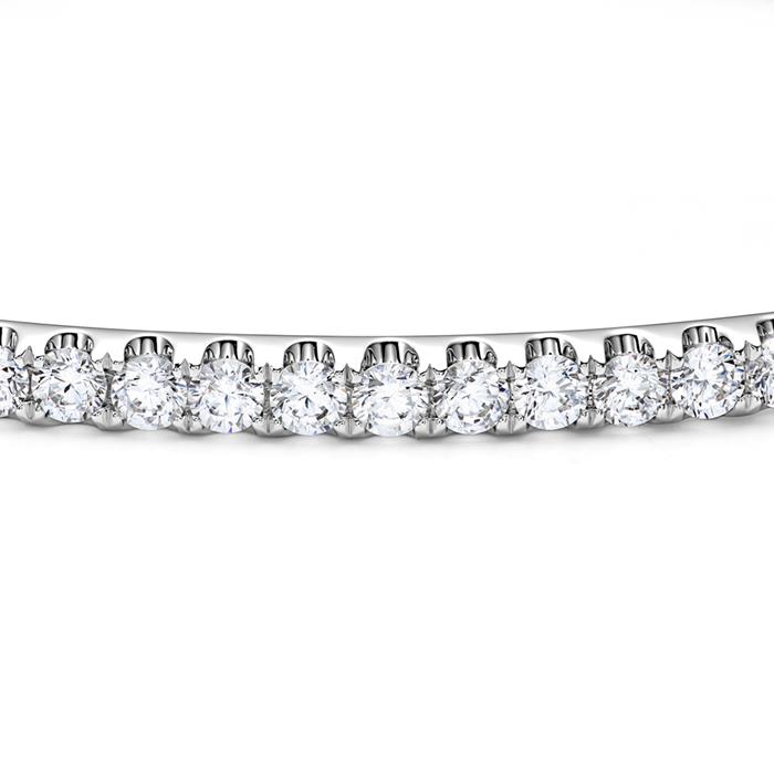 White gold or platinum bangle with diamond setting