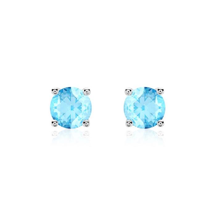 Ladies stud earrings in 14 carat white gold with blue topazes