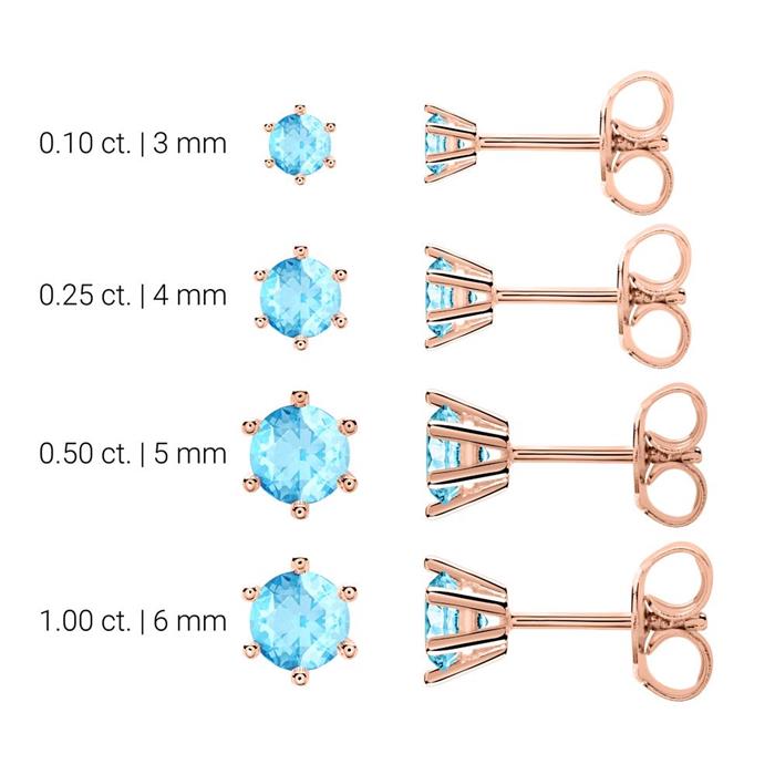 Ladies stud earrings in 14K rose gold with blue topazes