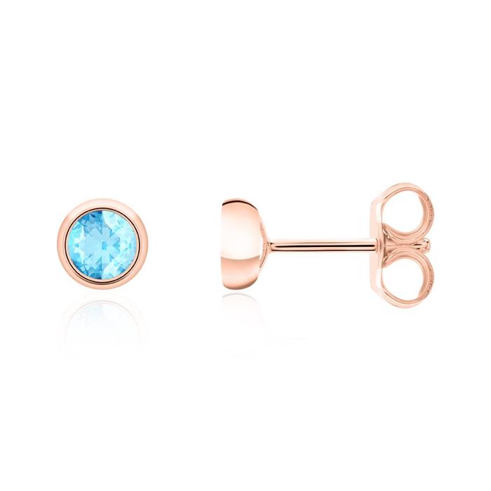 Ladies ear jewellery in 14K rose gold with blue topaz