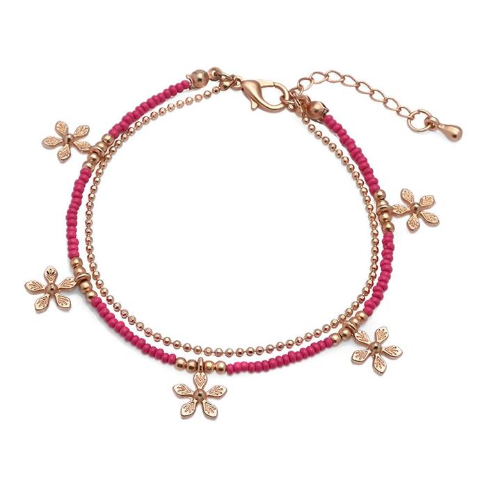 Dames armband fantasiejuwelen in goud/roze