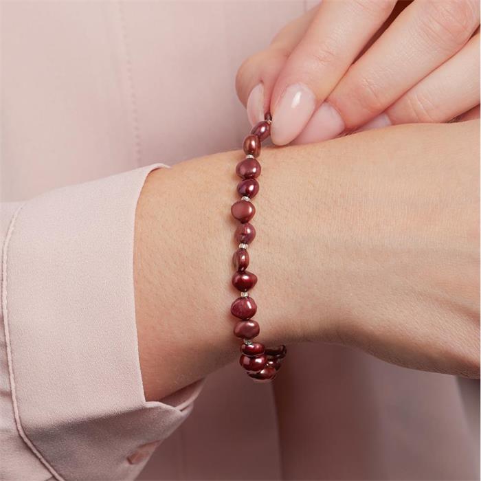 Elastic pearl bracelet in red colours