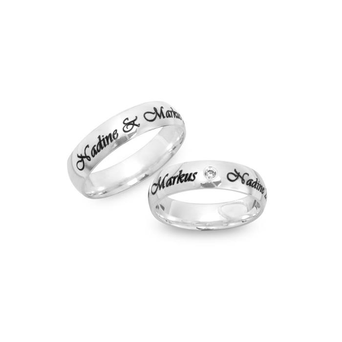 Shiny silver wedding rings with laser engraving