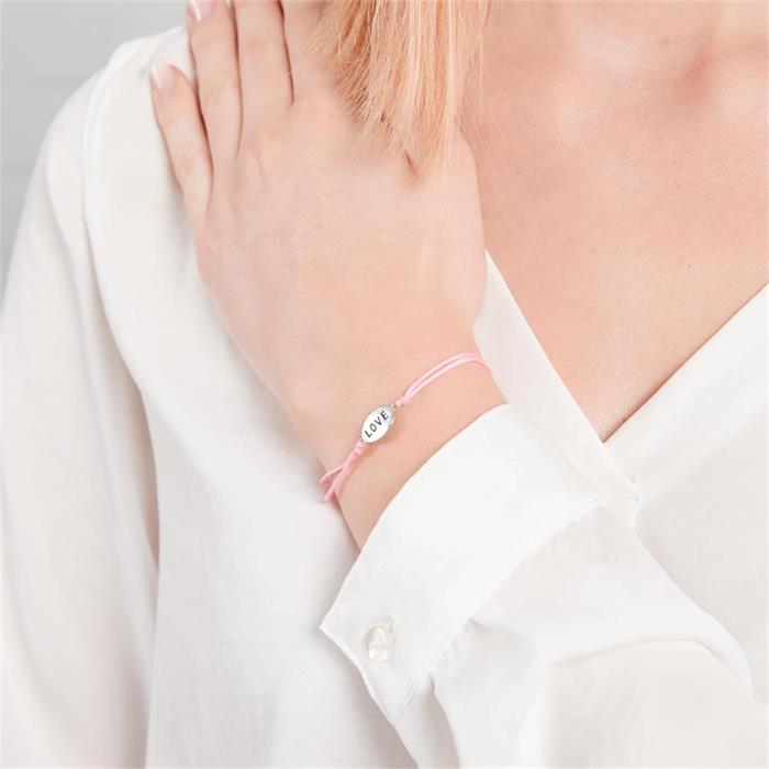 Pink textile bracelet with silver elements