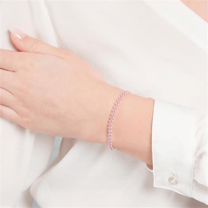 Pulsera textil rosa con elementos plateados