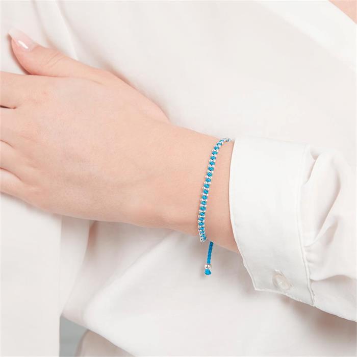Blauwe textiel armband met zilveren elementen
