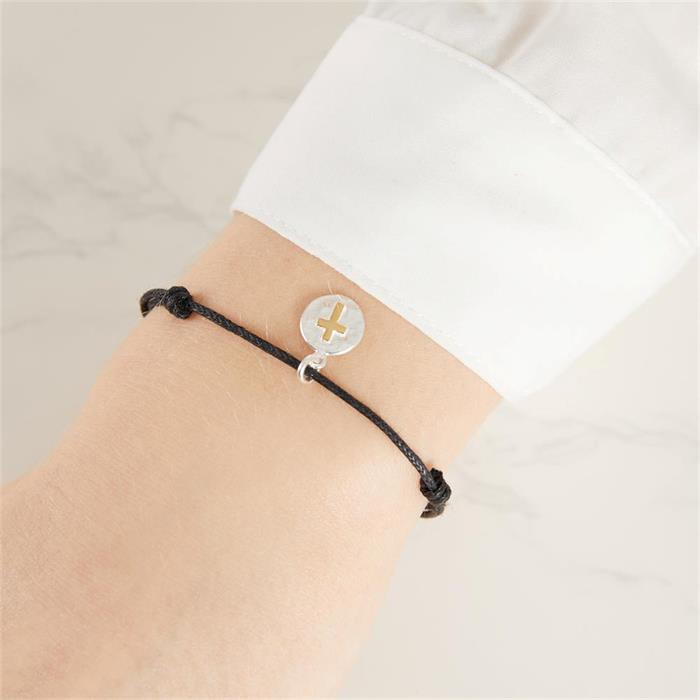 Adjustable textile bracelet with silver pendant