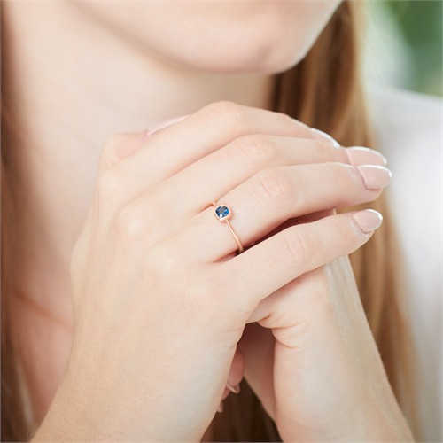 585er Roségold Ring mit Blautopas