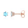 Ladies stud earrings in 14K rose gold with blue topazes