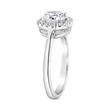 Halo engagement ring with diamonds in white gold, platinum