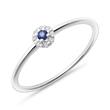 Ring in 14K white gold with sapphire and white topazes