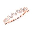 Ring for ladies in 14K rose gold with white topazes