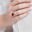 Polished sterling silver ring with red glass stone