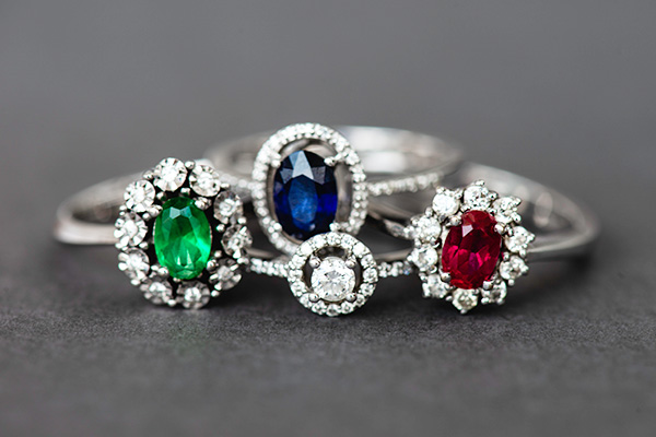 An emerald ring, sapphire ring, ruby ring, and diamond ring
