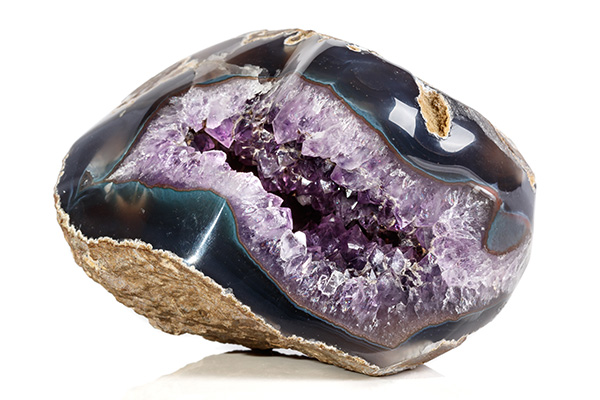 An Amethyst geode on a gray background