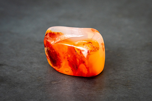 A carnelian on an anthracite-coloured surface