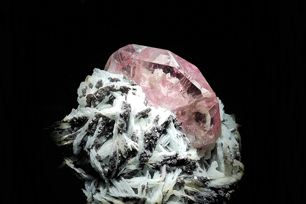 A morganite geode on a black background