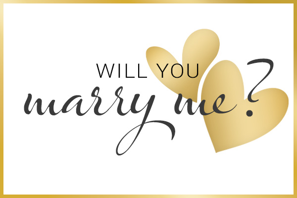 Two gold-coloured hearts and the text Will you marry me?